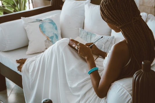 black woman journaling